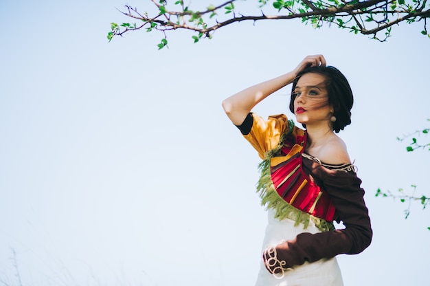 Beautiful bohemian girl in spring garden