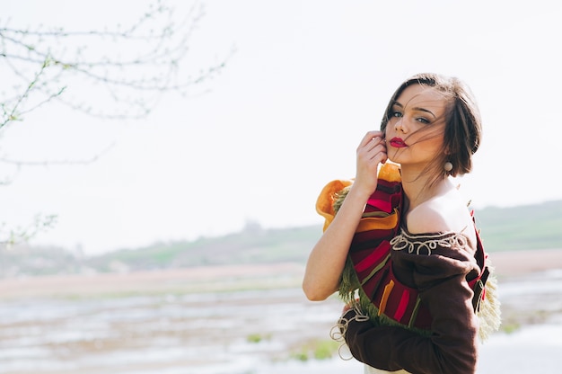 Beautiful bohemian girl in spring garden