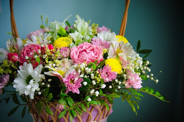 a beautiful bouquet of flowers in a basket