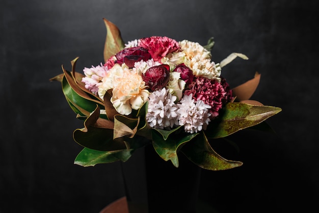 Beautiful bouquet of flowers on black background