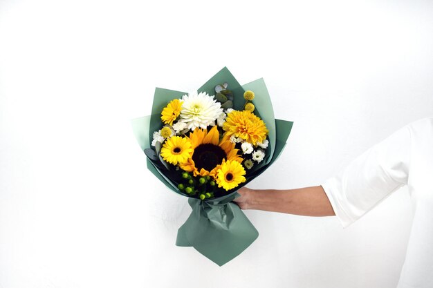 Beautiful bouquet of flowers in hands of awoman photo for postcard and catalog of an online flower shop fresh flower delivery