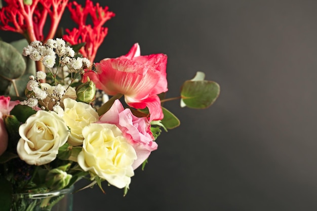 Beautiful bouquet of fresh flowers on black background