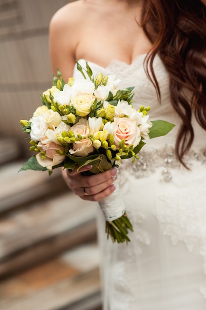 Beautiful bouquet in hands of the bride