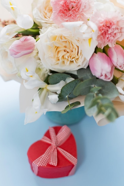 Beautiful bouquet and heart gift box