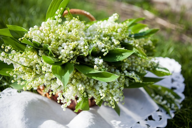 Beautiful bouquet of lily of the valley in the basket