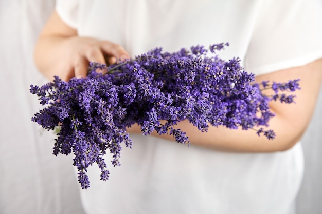 Beautiful bouquet of natural lavender flowers in female hands