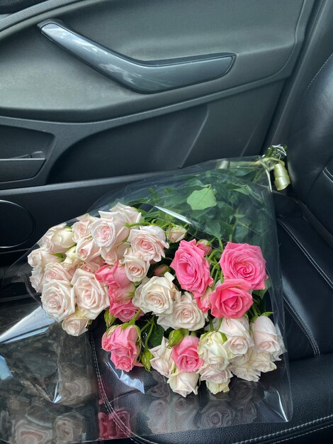 Beautiful bouquet of roses on the front seat