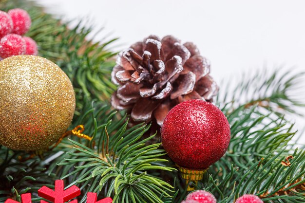 beautiful branches of the christmas tree with cones and toys