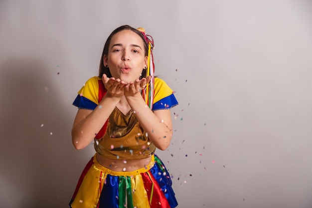 Beautiful brazilian caucasian woman wearing frevo carnival\
clothes wearing confetti