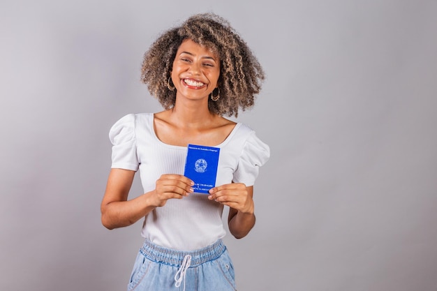 Beautiful Brazilian woman blackxAholding work card and social security