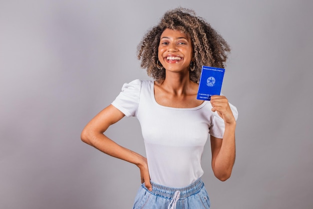 Beautiful Brazilian woman blackxAholding work card and social security