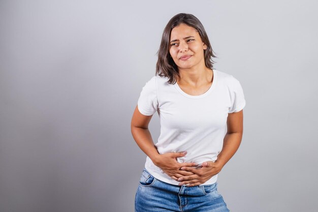 Beautiful brazilian woman denim and white stomach ache cramps