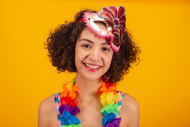 Beautiful brazilian woman dressed in carnival clothes closeup photo on her face selfie