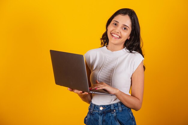 Beautiful brazilian woman holding notebook working