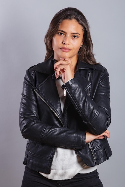 Beautiful Brazilian woman in leather jacket shirt photoshoot