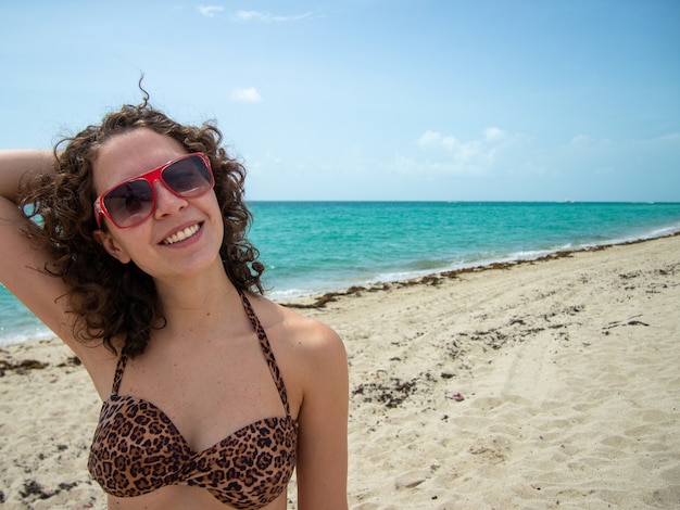 Beautiful Brazilian woman posing for camera on Miami Beach