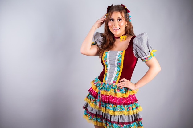 Beautiful Brazilian woman wearing country clothes for Festa de Sao Joao Festa Junina Posing for photo Half body photo