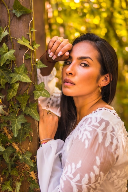 Beautiful Brazilian woman in a white dress