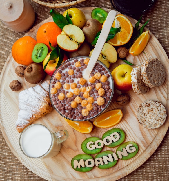 Beautiful breakfast. Milk fruits, bread and croissant.