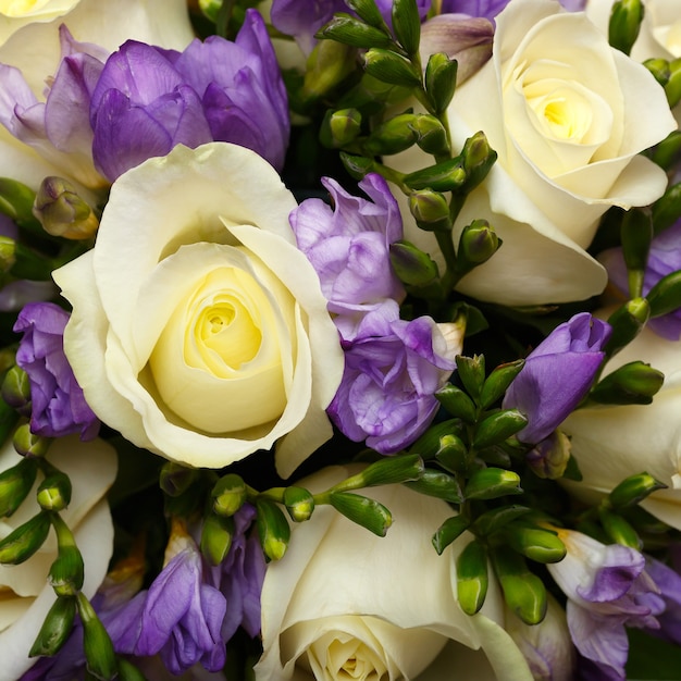 Beautiful bridal bouquet of lilies and roses at a wedding party