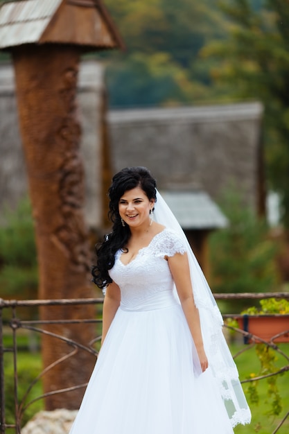 Beautiful bride in delicate dress outdoors