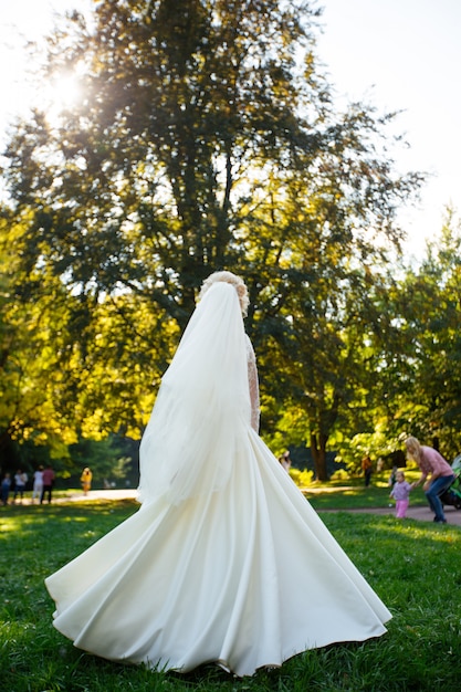 Beautiful bride in delicate dress outdoors