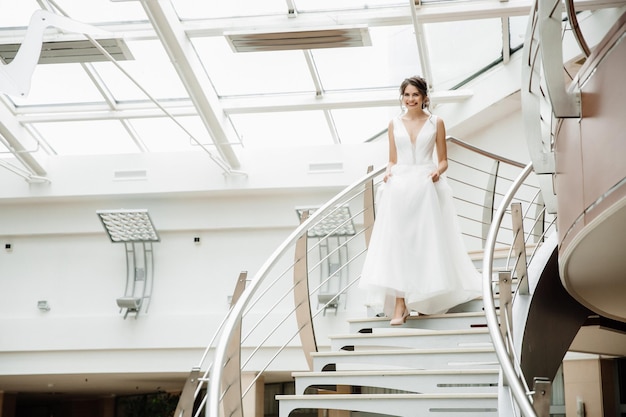 Beautiful bride descends the stairs