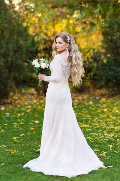 Beautiful bride in dress in the garden