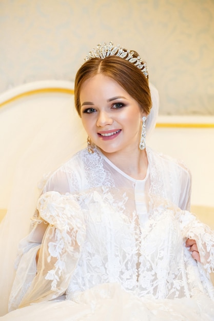 Beautiful bride dresses her white wedding dress