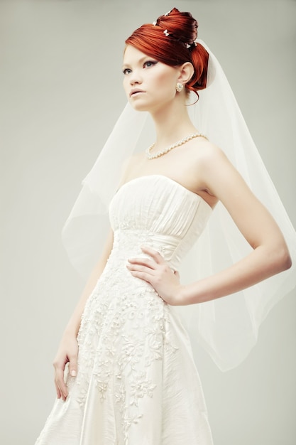 Beautiful bride in a luxurious wedding dress, studio shot