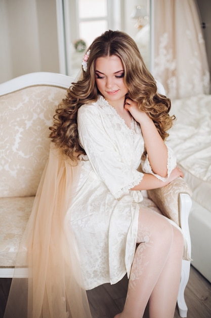 Beautiful bride in the morning in her room