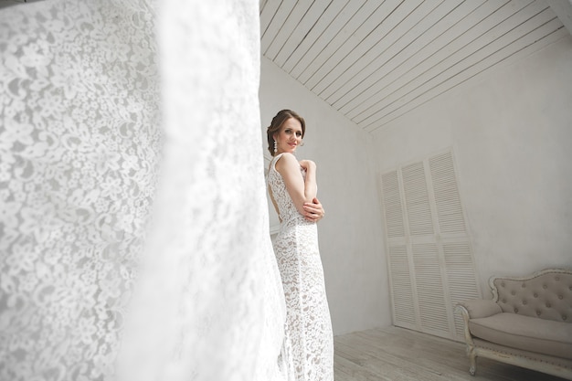 Beautiful bride posing in a wedding dress