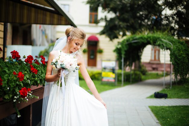 The beautiful bride smiling outdoors