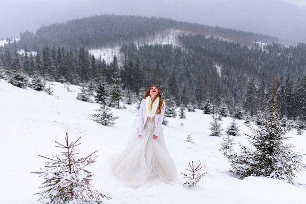 Beautiful bride in a snowy forest