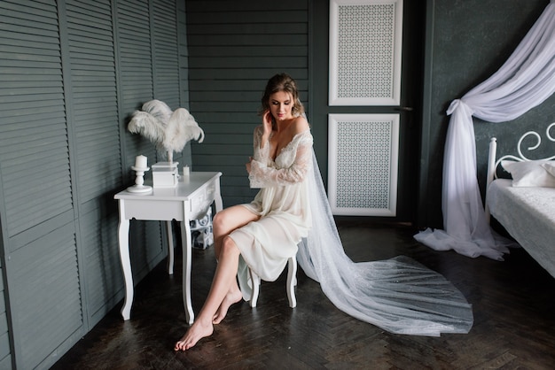 Beautiful bride in white lace lingerie