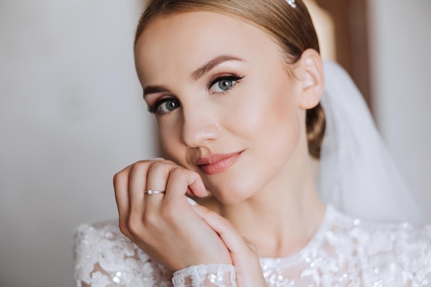 Beautiful bride with a fashionable wedding hairstyle wedding nude makeup