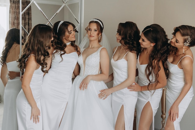 Beautiful bride with her pretty bridesmaids