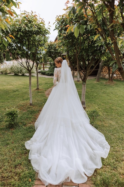 Beautiful bride with wedding flowers bouquet attractive woman in wedding dress