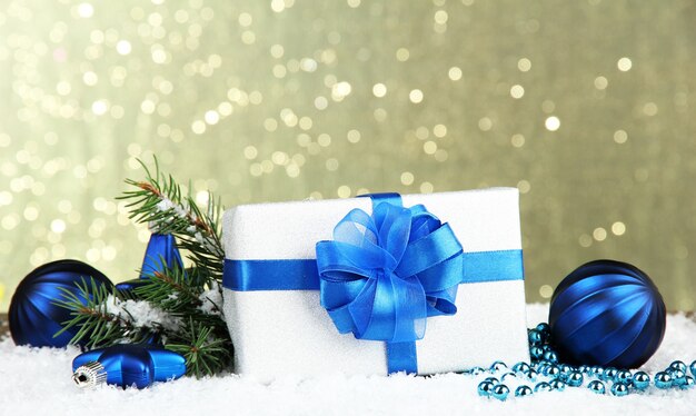Beautiful bright gift and christmas decor, on shiny background