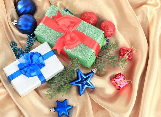 Beautiful bright gifts and christmas decor, on silk cloth