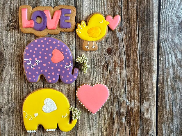 Beautiful bright handmade gingerbread cakes for Valentine's Day on a wooden background