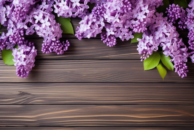Beautiful bright lilac flowers on wooden background closeup