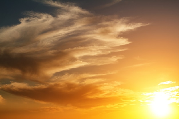 Beautiful bright sunset sky with clouds