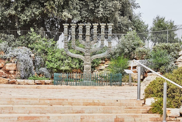 Beautiful bronze sculpture of the Menorah gifted to Israel by the Parliament of the United Kingdom is located opposite the entrance to the Israeli Parliament building in Jerusalem