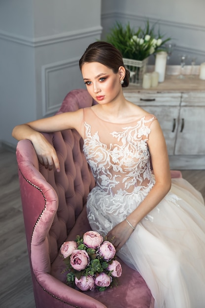 Beautiful brunette bride in her wedding dress