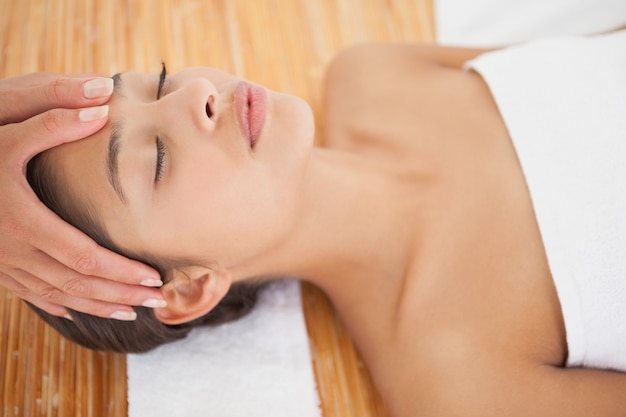 Beautiful brunette enjoying a head massage