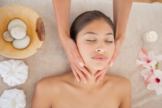 Beautiful brunette enjoying a head massage