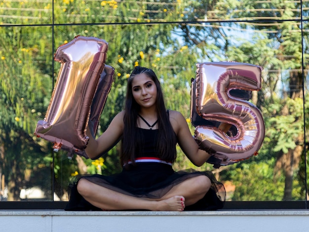 Beautiful brunette girl celebrating 15 years of life, debutante.