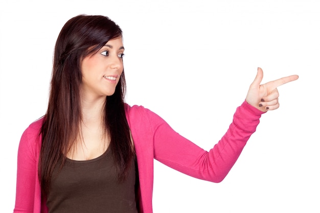 Beautiful brunette girl indicating something isolated on a over white background