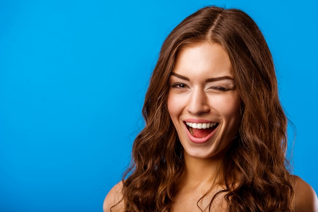 Beautiful brunette girl laughs